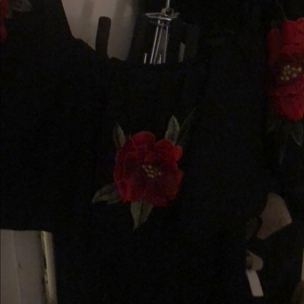 Red rose black jump suit off the shoulder